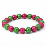 Entdecke das 3D Wonderperlen Armband in Pink und Grün – ein handgefertigtes Schmuckstück, das Lebendigkeit symbolisiert und jeden Look perfekt unterstreicht.