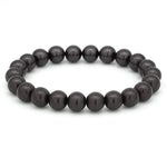 Elastisches Armband aus runden, glänzenden Perlen in tiefem Dunkelgrau auf weißem Hintergrund.