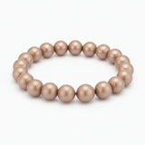 Perlenarmband in zartem Taupe-Ton mit glänzenden, runden Kugelperlen auf elastischem Band.