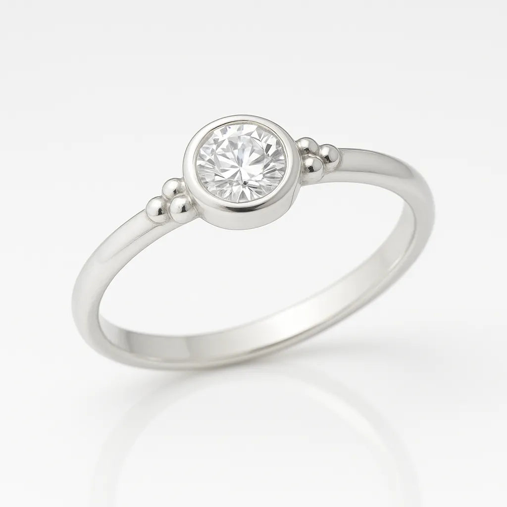 "Feiner Damenring aus Silber mit rundem, funkelndem Zirkonia in Zargenfassung und zarten Kugeldetails – eleganter Verlobungsring bzw. Silberring für Damen"