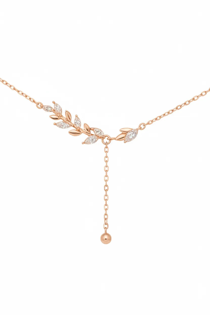 Damen Halskette aus rosévergoldetem 925 Sterling Silber mit filigranem Blätterdesign, funkelnden Kristallen und herabhängender Y-Kette im modernen, femininen Stil.