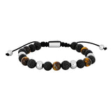Dieses Herrenarmband besteht aus schwarzen Lava- und Achatperlen mit Tigerauge, kombiniert mit Edelstahl-Elementen und richtet sich an stilbewusste Männer.