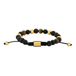 Herrenarmband mit schwarzen Achat- und Lavaperlen sowie Tigerauge, goldfarbenen Edelstahlakzenten und schwarzem, verstellbarem Makraméband – elegantes, maskulines Design.