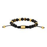 Herrenarmband mit schwarzen Achat- und Lavaperlen sowie Tigerauge, goldfarbenen Edelstahlakzenten und schwarzem, verstellbarem Makraméband – elegantes, maskulines Design.