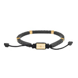 Das Bild zeigt ein ultraflaches Unisex-Armband aus schwarzen Achatplättchen mit silbernen oder goldfarbenen Edelstahlelementen und verstellbarem Textilband für stilbewusste Damen und Herren.