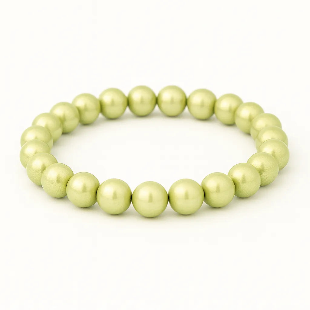 3D Wonderperlen Armbands mit glänzenden, pastellgrünen Perlen auf elastischem Band, gleichmäßig rund angeordnet.