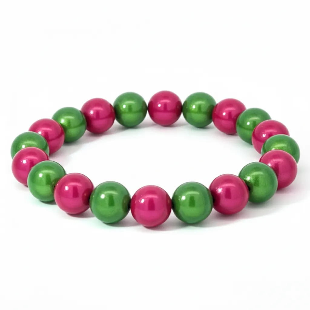 Entdecke das 3D Wonderperlen Armband in Pink und Grün – ein handgefertigtes Schmuckstück, das Lebendigkeit symbolisiert und jeden Look perfekt unterstreicht.