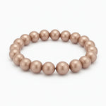 Perlenarmband in zartem Taupe-Ton mit glänzenden, runden Kugelperlen auf elastischem Band.